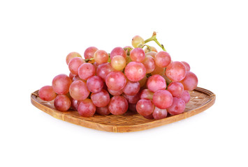 bunch of fresh grapes in bamboo basket on white background