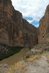 Fototapeta na wymiar Entrance to the Saint Elena Canyon Trail, Big Bend National Park, Texas. This trail is easily accessible and affords great views of the Rio Grande River .