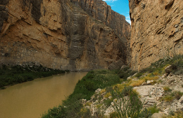 Fototapeta na wymiar A view of the Rio Grande River and Mexico from the Saint Elena Canyon Trail, Big Bend National Park, Texas. This trail is easily accessible and affords great views of the river .