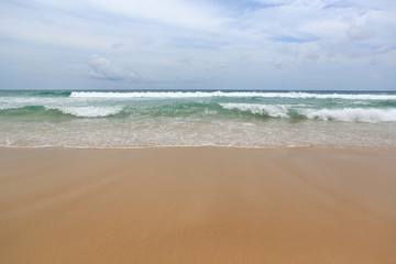Fototapeta na wymiar Surf wave and sea beach sand background.
