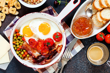 Breakfast including coffee, fried egg , becon. nut , muesli and bread . Top view