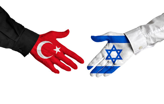 Turkey and Israel diplomats shaking hands for political relations
