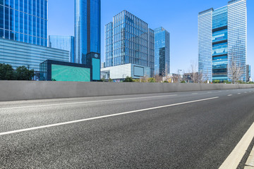 empty asphalt road front of modern buildings.