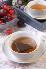 Tea bag in the cup with hot water 