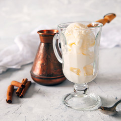 coffee with ice cream in a glass on a table, selective focus