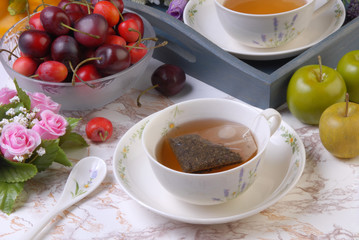 Tea bag in the cup with hot water 