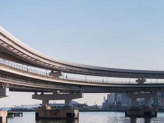 Tokyo bay with rainbow bridge closeup in Japan. Rainbow Bridge is a suspension bridge connecting Tokyo's "Shibaura area" and "Daiba area"