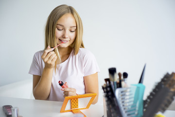 Girl applying makeup
