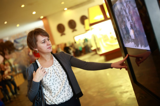 Woman using touch screen