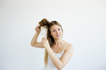 Girl taking care of her hair