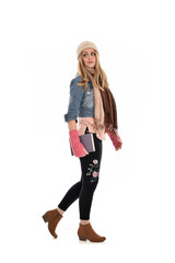 full length portrait of a cute girl wearing fall fashion, standing pose on white background.