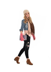full length portrait of a cute girl wearing fall fashion, standing pose on white background.