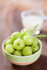 Indian gooseberry fruit and juice on wooden background,healthy food