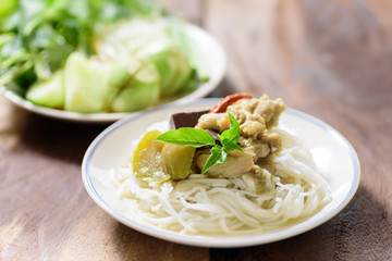 Thai food, rice vermicelli noodles with green curry chicken