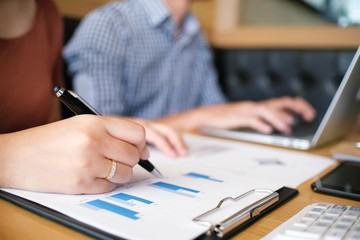 Hands of business people analyzing chart Finance managers task