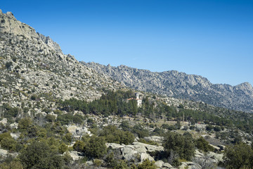 Fototapeta na wymiar Views of La Cabrera Range, in Madrid, Spain. It can be seen the Convent of San Antonio, and the Honey Peak (Pico de la Miel, in Spanish).