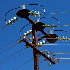 power line with electrical pole in the clear sky