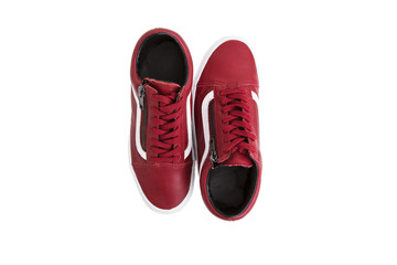 Fashion shoes with shoestring. Red sneaker and shoelace on white background