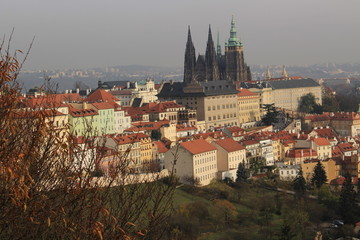 Obraz premium View on colorful autumn Prague City with its Towers and historical Buildings, Czech Republic