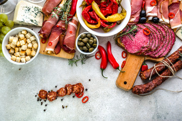 Traditional spanish tapas on table, food from spain, variety dishes, cold meat chorizo, ham and salami