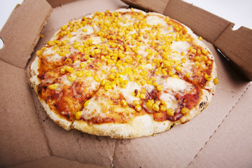 Delivery box with delicious pizza on white background.