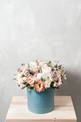 Luxury bouquets of mix flowers in the hat box. vintage color