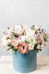 Luxury bouquets of mix flowers in the hat box. vintage color