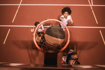 Naklejka premium Guys playing basketball