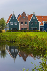 Fototapeta na wymiar Volendam is a town in North Holland in the Netherlands. Colored houses of marine park in Volendam. North Holland, Netherlands.