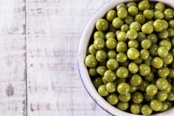 canned Green peas l on old wooden background,healthy vegan food
