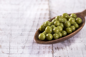 canned Green peas l on old wooden background,healthy vegan food