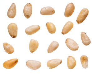 Fototapeta na wymiar Seeds of pines or pine nuts on the white background.