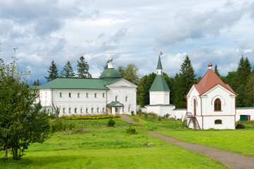 Fototapeta na wymiar Svyatoozerskaya Valday Iversky Bogoroditsky monastery. The Church of Iakov Borovichsky and the Tomb Panaeva with a chapel