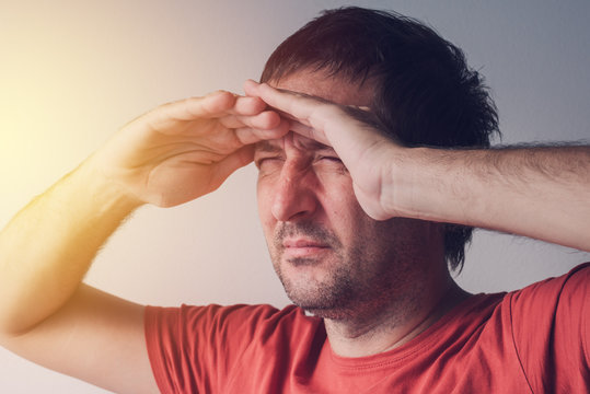 Man Looking Towards The Bright Light Source