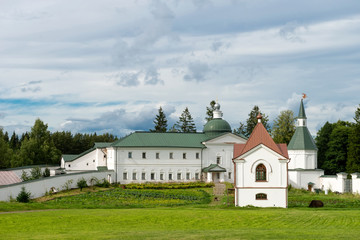 Fototapeta na wymiar Svyatoozerskaya Valday Iversky Bogoroditsky monastery. The Church of Iakov Borovichsky and the Tomb Panaeva with a chapel