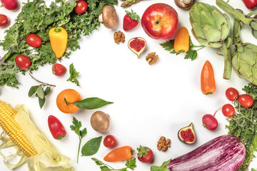 Vibrant fresh vegetables and fruits on white with copyspace