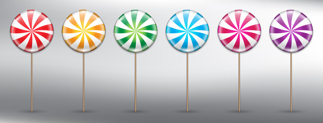 Set of 6 colorful lollipops. Round candy on stick with swirl design. Lollipop icon set. Design elements for holiday cards. Realistic and isolated on the white panel. Vector illustration. Eps10.