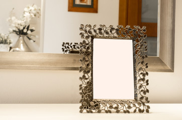 Ornate picture frame on the white table Reflection in Mirror Blank White Isolated Clipping Path