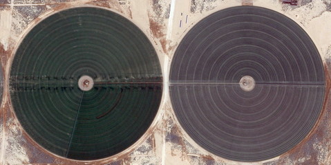 The power of the wind, farms of human crops in the desert, abstract photography of the deserts of   Africa from the air. aerial view , Genre: Abstract Naturalism, from the abstract to the figurative, 