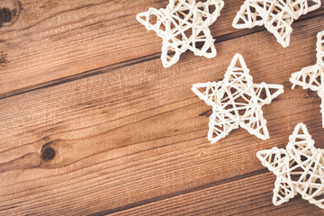 Christmas hand made stars on wooden table. Background with copy space.