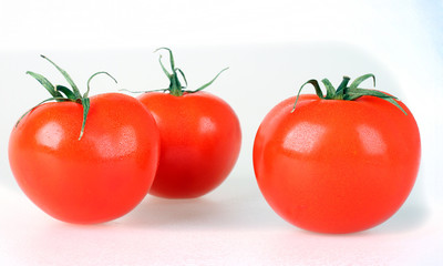Fresh tomatoes isolated on white background