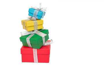 Gift multicolored boxes wrapped in recycled paper with ribbon isolated on white