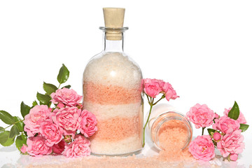 Sea salt with rose extract. Pink White Layer Cosmetic Bath Salt  in a glass bottle and fresh...
