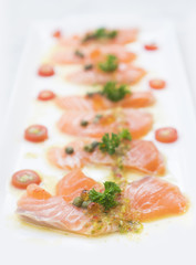 Salmon Fish Raw salmon fillet pepper salt dill lemon rosemary on plate