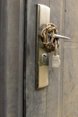 Metal door with chain and lock