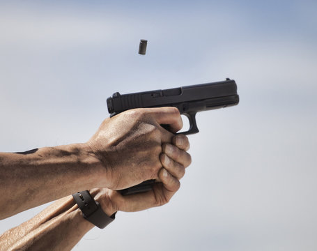 Handgun being shot