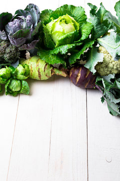 Various of Cabbage Broccoli Cauliflower. Assorted of Cabbages on white wooden background. Flat lay.