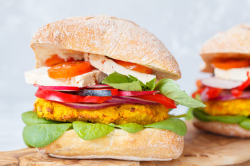 Vegan lentils burgers with tofu and vegetables.