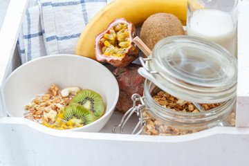Healthy breakfast: muesli, yoghurt, fruit in a white box