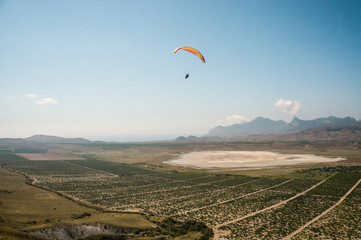 person flying on paraglider